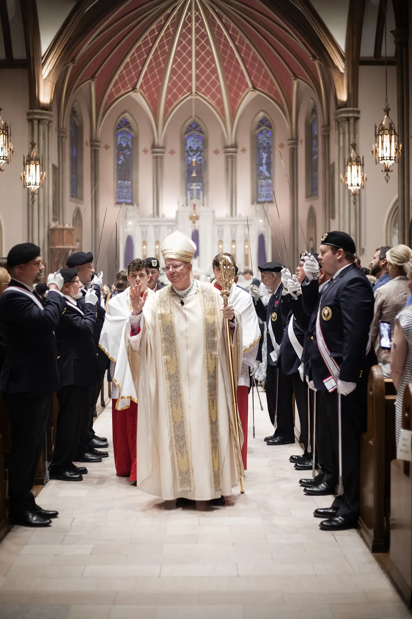 Bishop Malone greeting the faithful at the Diocese of Shreveport Chrism Mass, March 2026, flanked by the Knights of Columbus