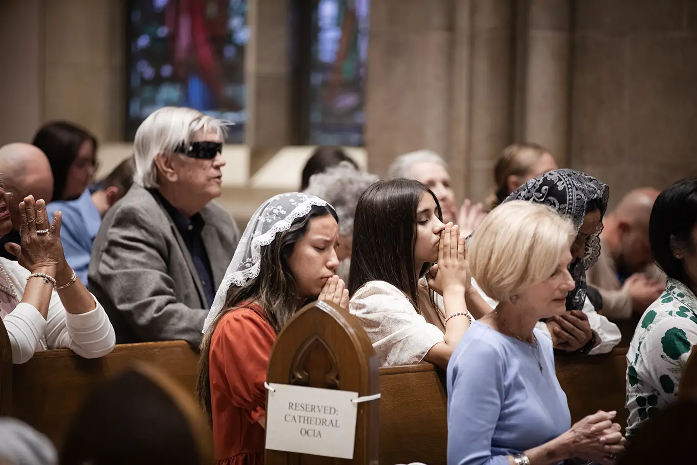 Parishioners praying in the pews at the Diocese of Shreveport Chrism Mass, March 2026
